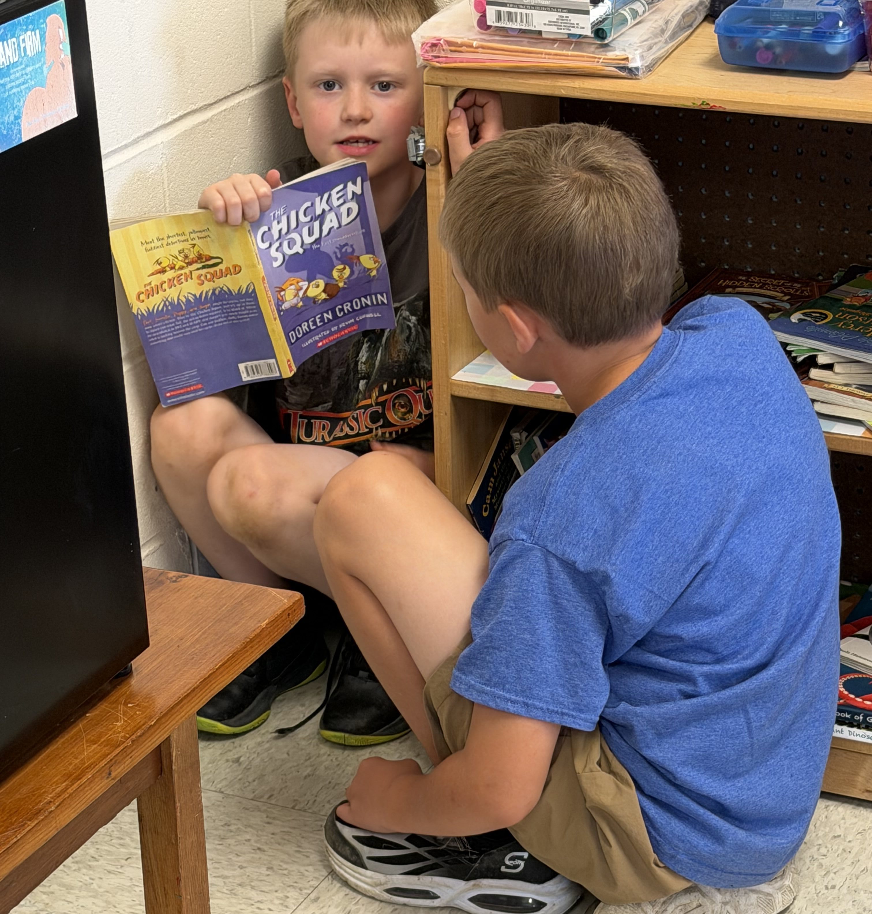 Students enjoying a book together